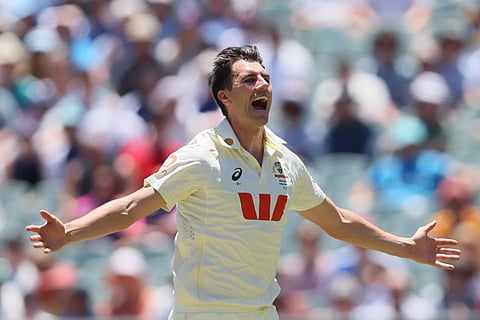 Australia's captain Pat Cummins celebrates the wicket of England's Joe Root during play on day two of the third Ashes cricket test between England and Australia in Adelaide, Australia, Thursday, Dec. 18, 2025.