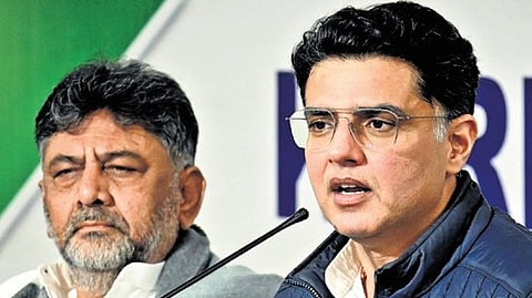 Congress leader Sachin Pilot addresses the media in Bengaluru on Monday. DCM DK Shivakumar looks on.