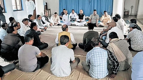 Mohammed Moquim holding a meeting with other leaders.