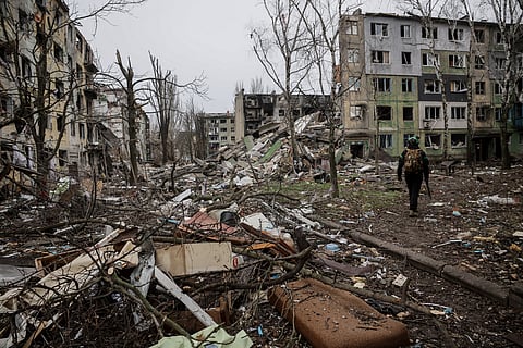 In this photo taken on Saturday Dec. 20, 2025 and provided by Ukraine's 24th Mechanized Brigade press service, a soldier walks through the ruins of the town of Kostyantynivka, in the Donetsk region, Ukraine.