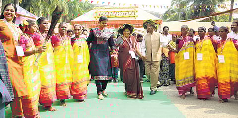Participants perform a tribal dance during the inaugural of PESA Mahotsav 2025 at the Port Stadium in Visakhapatnam on Tuesday.