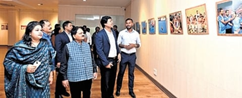 Dilip Tirkey is going round the photo exhibition at the State Museum