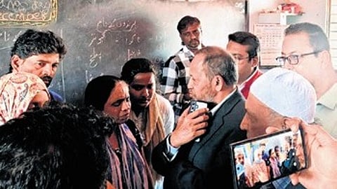 Minority Commission Chairman U Nisar Ahmed interacts with residents of Fakeer Layout on Wednesday.