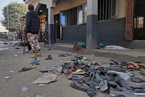Flip-flops belonging to worshippers are seen following a deadly bomb explosion at a mosque in Maiduguri, Nigeria, Thursday, Dec. 25, 2025.