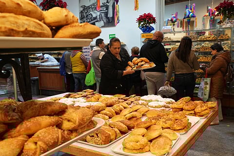 People buying pastries at a bakery in Mexico City