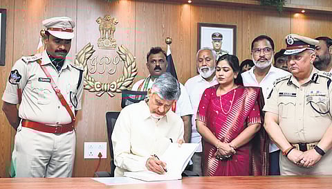 Chief Minister Nara Chandrababu Naidu signs in the register after inaugurating the Tirupati District Police office on Friday.
