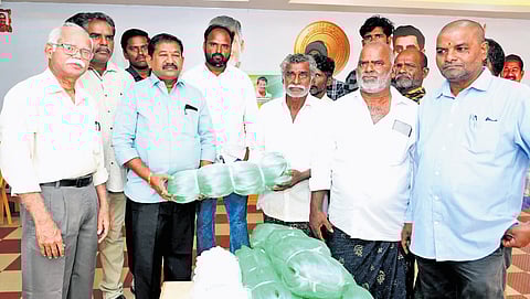 Social Welfare Minister Dola Sree Bala Veeranjaneya Swamy distributes fishing net units to fishers in Ongole