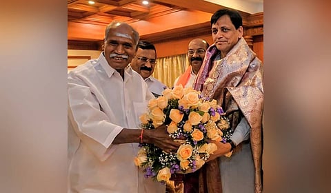 Chief Minister N Rangasamy (L) welcoming Union Minister of State for Home Affairs, Nityanand Rai, in Puducherry.