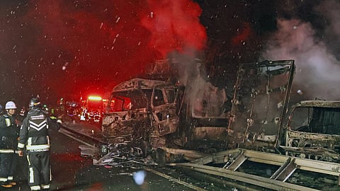 Burnt vehicles are seen after a massive crash in snowy weather on an expressway, in Minakami, northwest of Tokyo, early Saturday, Dec. 27, 2025.