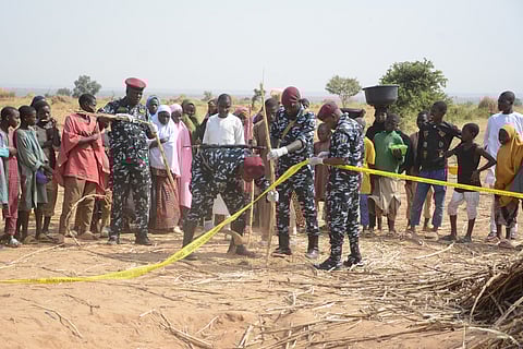 Nigeria police, Anti-Bomb squad, secure the scene of a U.S. airstrike in Northwest, Jabo, Nigeria, Friday, Dec. 26, 2025.