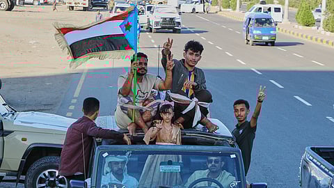 Supporters of the Southern Transitional Council (STC), a coalition of separatist groups seeking to restore the state of South Yemen, hold a South Yemen flag during a rally in Aden, Yemen, Dec. 25, 2025.