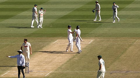 England's Jamie Smith, center right, and batting partner Harry Brook shake hands after defeating Australia on Day 2 of their Ashes cricket test match in Melbourne, Saturday, Dec. 27, 2025.