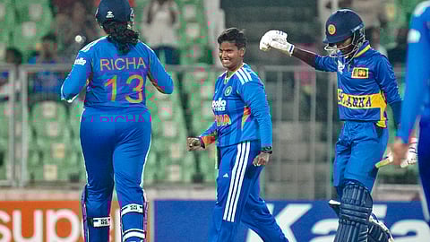 IndiaÂ’s Deepti Sharma, centre, celebrates a wicket with Richa Ghosh, left, during the third T20 International cricket match of a series between India Women and Sri Lanka Women on Dec. 26, 2025.
