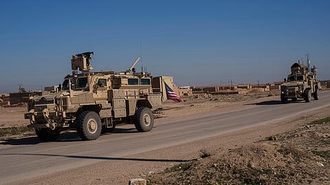A US military convoy drives along a road in northeastern Syria's Hasakeh province, Thursday, Jan. 30, 2025.