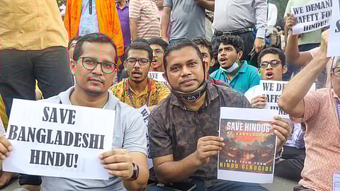 Bangladesh Hindu community members participate in a protest and block the Shahbagh intersection in Dhaka, Bangladesh.