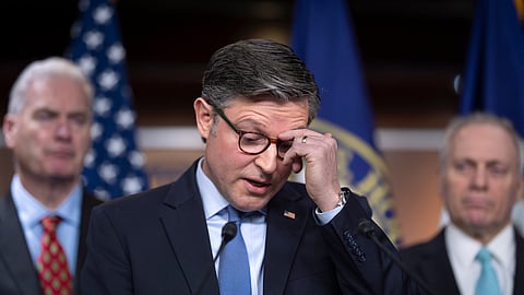 Speaker of the US House of Representatives Mike Johnson, R-La., pauses as he talks with reporters as Republicans struggle with a plan to address growing health care costs at the Capitol in Washington, Tuesday, Dec. 16, 2025.