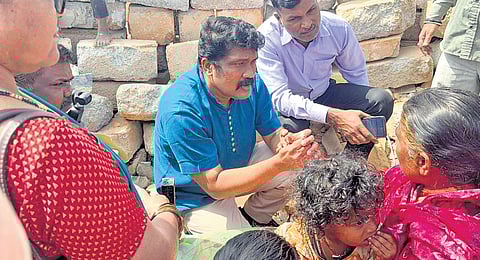 CPM MP A A Rahim interacts with the residents of Fakir Colony in Bengaluru