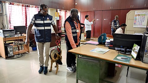 The bomb detection and disposal squad of the police conducting a search at the Coimbatore Collectorate building following a bomb threat on Thursday.