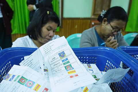 Officials of the Union Election Commission prepare to count votes at a polling station, during the first phase of general election, in Naypyitaw, Myanmar, Sunday, Dec. 28, 2025.