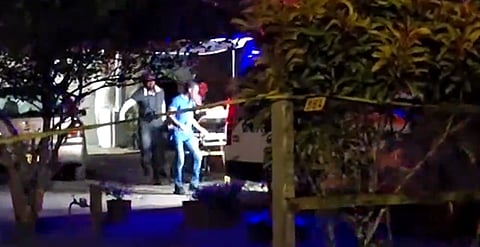 Suriname's Police Corps said the suspect attempted to attack police officers who arrived on the scene and he was injured during his arrest.