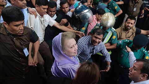 FILE - Bangladesh's former prime minister and Bangladesh Nationalist Party leader Khaleda Zia, center, leaves court after a hearing in Dhaka, Bangladesh, Aug. 10, 2016.