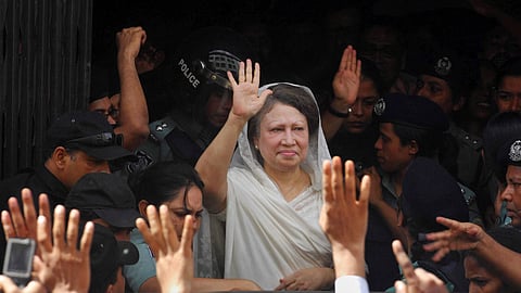 Former Bangladesh Prime Minister Khaleda Zia waves to supporters after she was arrested in Dhaka, Bangladesh, on Sept. 3, 2007.