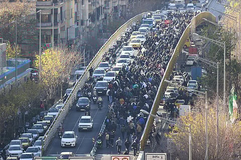 Protesters march in downtown Tehran, Iran, Monday, Dec. 29, 2025.