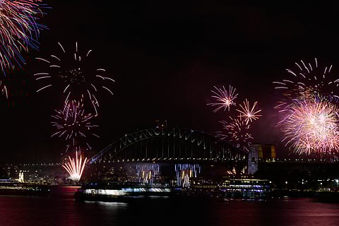 Fireworks burst over the Sydney Harbour Bridge as New Year's celebrations begin in Sydney, Wednesday, Dec. 31, 2025.
