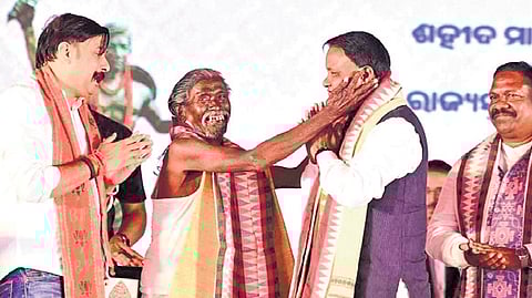 CM Majhi with Padma Shri Haldhar Nag and other guests at the event | EXPRESS