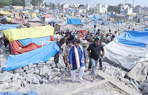 BJP leaders R Ashoka interact with Kogilu residents on Wednesday.