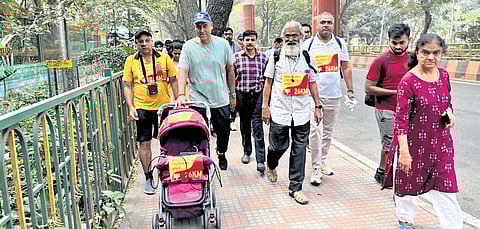 GBA Chief Commissioner M Maheshwar Rao walks with citizens on Thursday