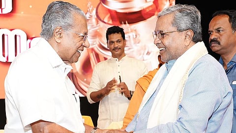 Chief Minister Siddaramaiah greets his Kerala counterpart Pinarayi Vijayan at Shivagiri Mutt in Thiruvananthapuram, Kerala, on Wednesday.