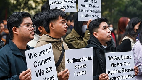 North East students union members hold placards during a protest against the killing of Tripura student Angel Chakma, at Jantar Mantar in New Delhi, Wednesday, Dec. 31, 2025.