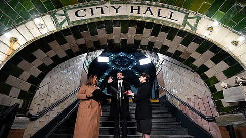 New York Attorney General Letitia James, left, administers the oath of office to mayor-elect Zohran Mamdani, center, as his wife Rama Duwaji looks on, Thursday, Jan. 1, 2026, in New York.