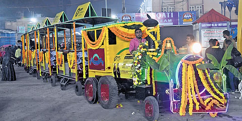 On the first day, a toy train waits for passengers at Numaish in the city.