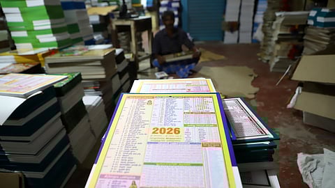 Workers engaged in making calender for the year 2026 at Town hall in Coimbatore