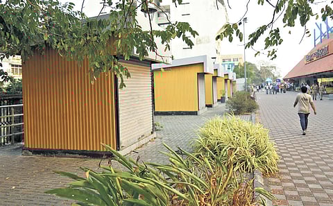 The unopened food and beverage kiosks in front of the High Court water metro terminal