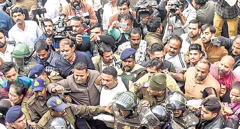 Policemen control the crowd after a clash between Congress and BJP workers in Bhagirathpura area, where water contamination claimed at least 10 lives | PTI