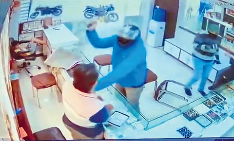 CCTV footage of the armed robbers during their heist.