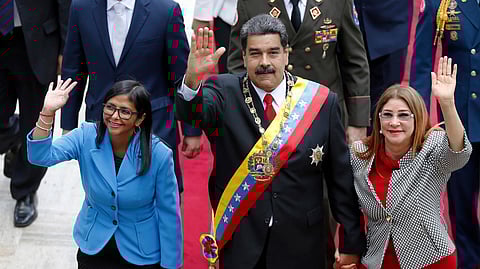FILE - Venezuela's President Nicolas Maduro, then Constituent National Assembly President Delcy Rodriguez, left, and first lady Cilia Flores, wave as they arrive to the National Assembly, in Caracas, Venezuela, May 24, 2018.