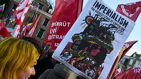 Demonstrators protest outside the U.S. Consulate General in Amsterdam, Netherlands, Sunday, Jan. 4, 2026, against the U.S. bombing of Venezuela and seizure of President Nicolas Maduro