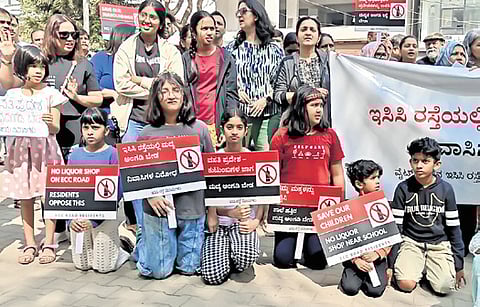 Residents stage a flash protest on
ECC Road in Whitefield on Sunday