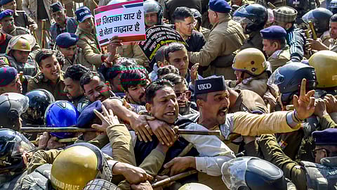 Police stop members of various organisations during a protest march towards the Uttarakhand Chief Minister's residence, demanding a CBI probe into the Ankita Bhandari murder case, in Dehradun, Sunday, Jan. 4, 2026