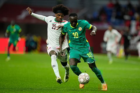 Sudan's Sheddy Ezeldin, left, and Senegal's Sadio Mane fight for the ball during the Africa Cup of Nations best of 16 soccer match between Senegal and Sudan in Tangier, Morocco, Saturday, Jan. 3, 2026.