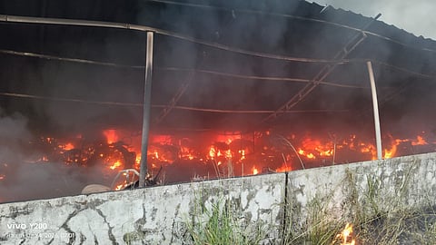 The fire spreading in the bike parking of Thrissur Railway Station on Sunday morning.