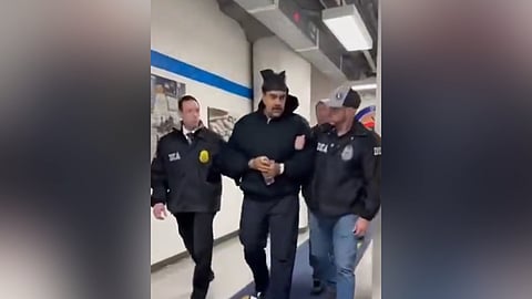 This screengrab taken from the X account of Rapid Response 47, the official White House rapid response account, shows Venezuelan President Nicolas Maduro (C) escorted by DEA agents inside the headquarters of the US Drug Enforcement Administration (DEA) in lower Manhattan, New York, on January 3, 2026.