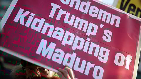 An activist holds a sign during an anti-Trump rally to condemn the U.S. conducting a military act on Venezuela to capture its President Nicolas Maduro and his wife Cilia Flores, in central Seoul, South Korea on January 5, 2026