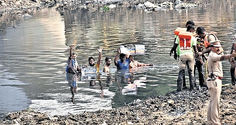 Sanitation workers from Royapuram and Thiru Vi Ka Nagar staged protest in Cooum on Monday and were removed.