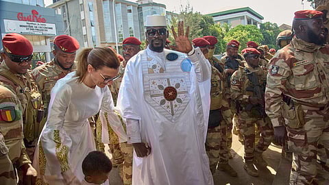 File picture of Guinea's President, General Mamadi Doumbouya, arriving with his wife, Lauriane Doumbouya, to cast their votes in the presidential election in Conakry, Guinea