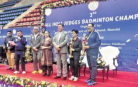 Justice Sabitri Ratho and Justice V Narasingh receiving the trophy | Express